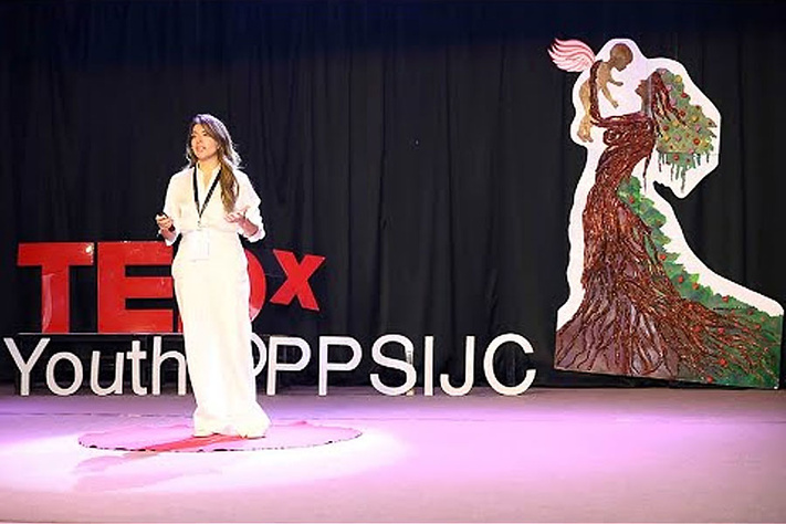 This image shows Dvija Mehta presenting at TEDxYouth@PPSIJC about ethical artificial intelligence.